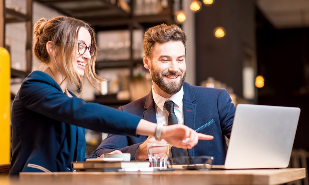 business people looking at a computer