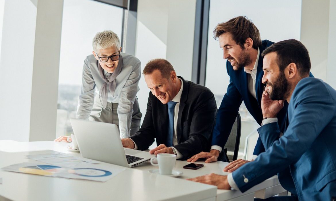 business people looking at a computer