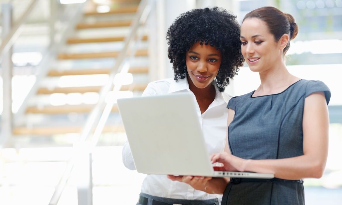 business people looking at a computer