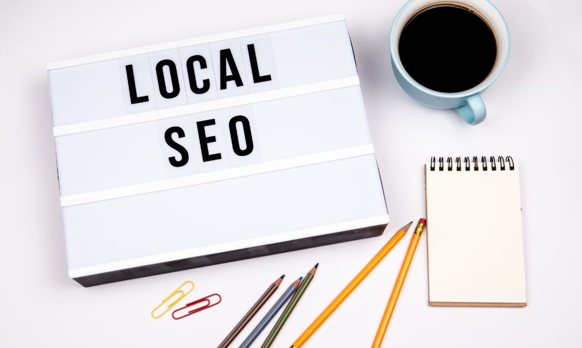cup of coffee, note pad and text that reads "local SEO"