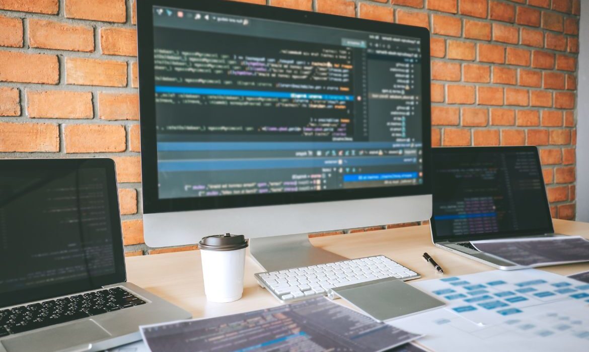 Macbook screen with computer html code