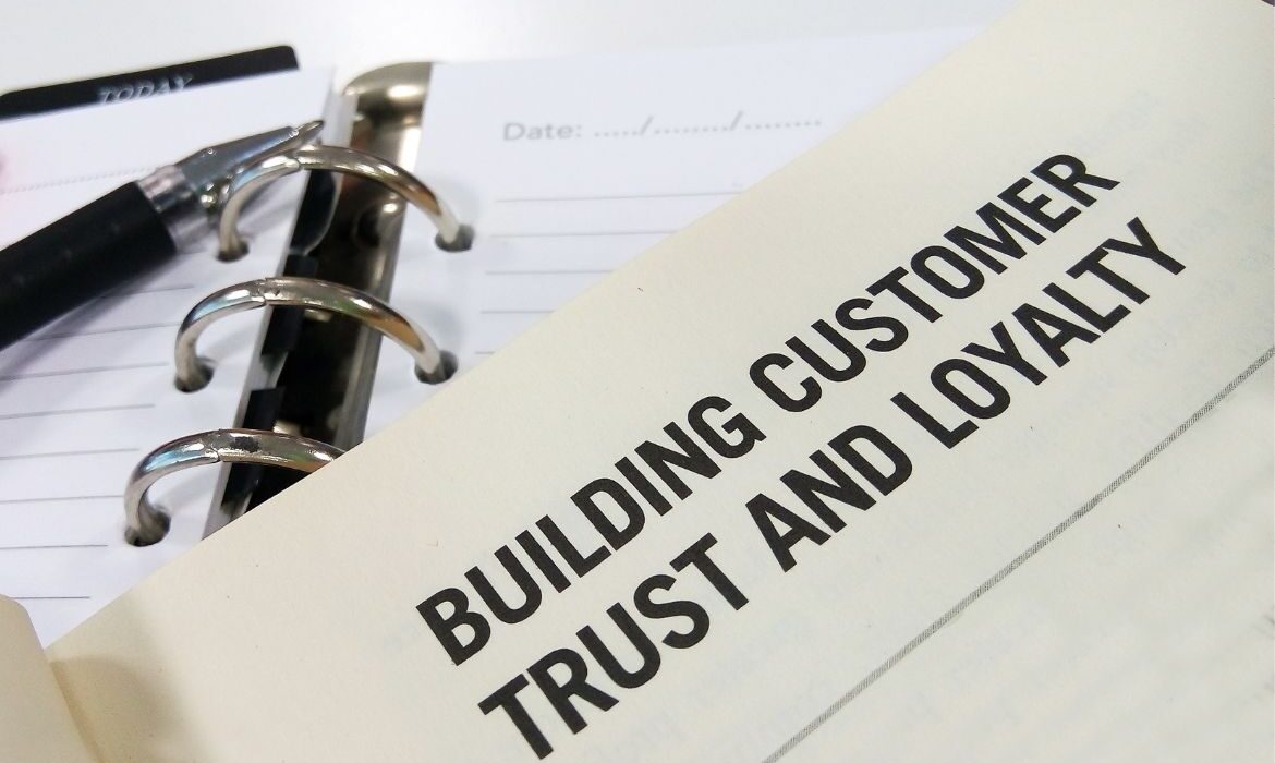 piece of paper with text "how to build trust"