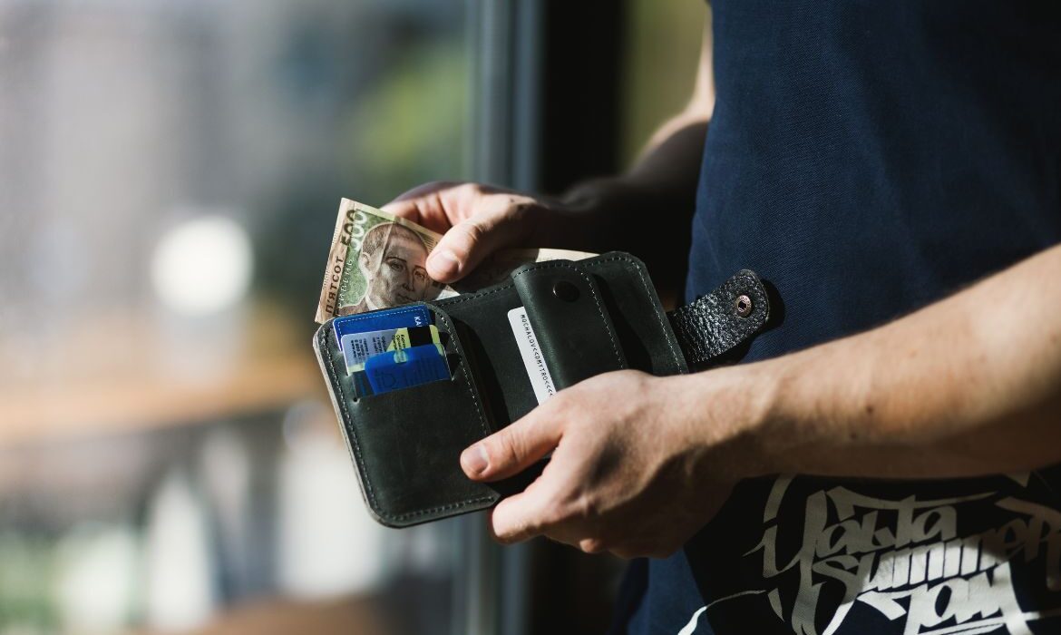 man opening his wallet