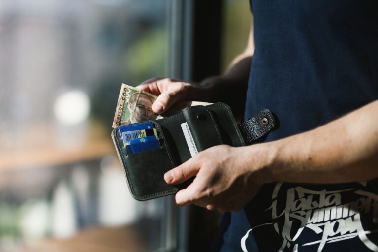 man opening his wallet