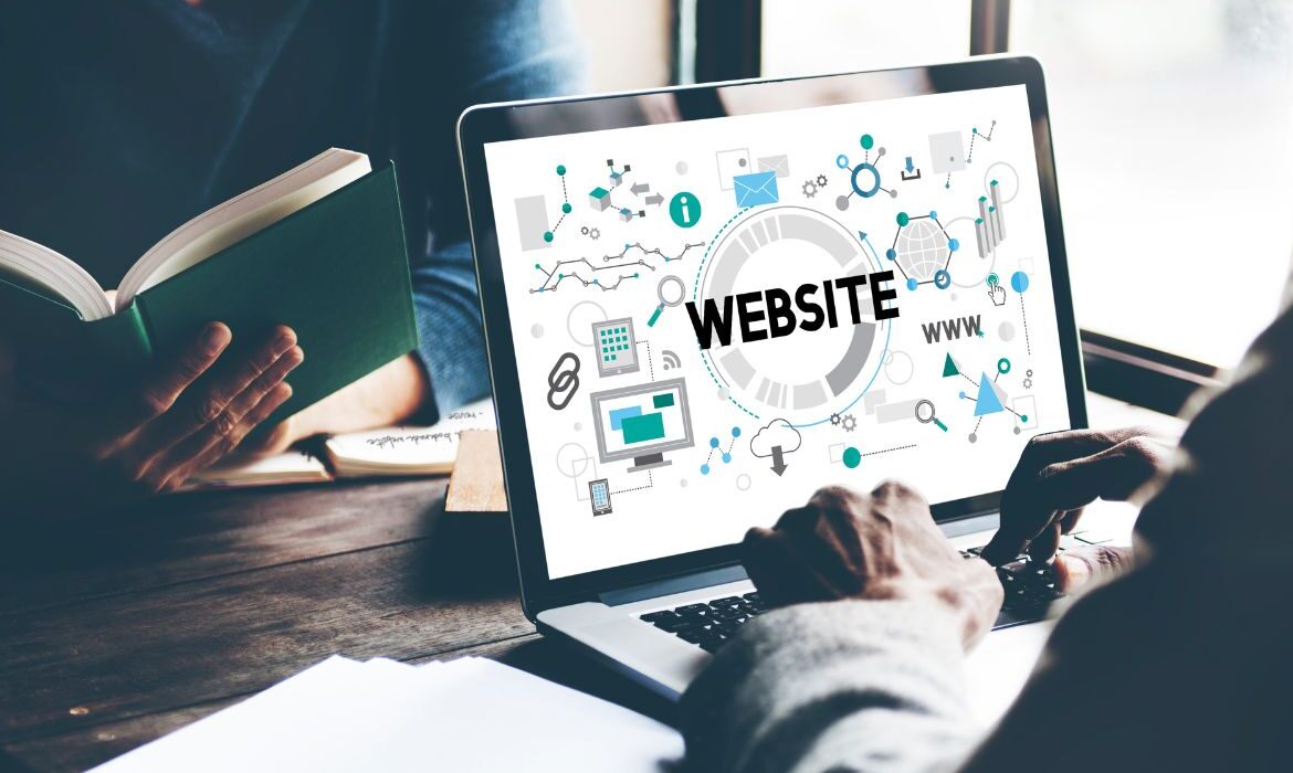 someone designing a website on a laptop