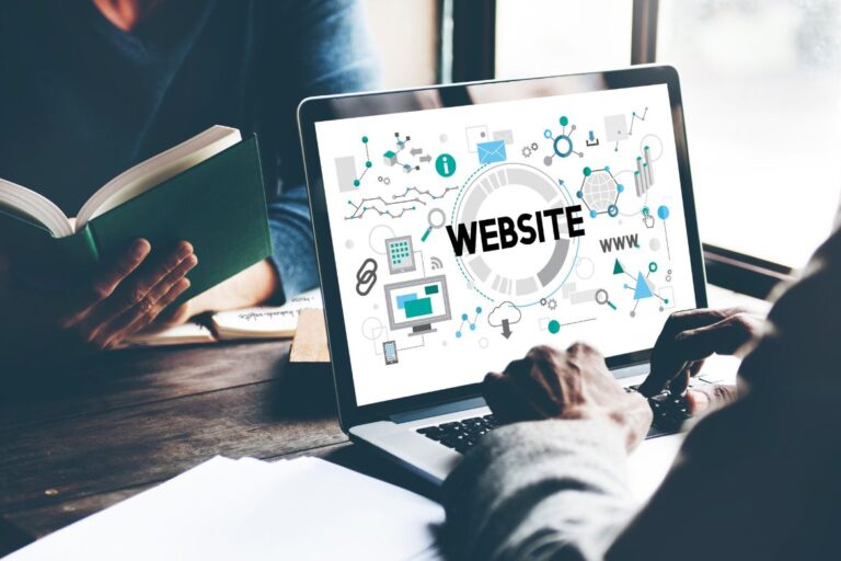 someone designing a website on a laptop