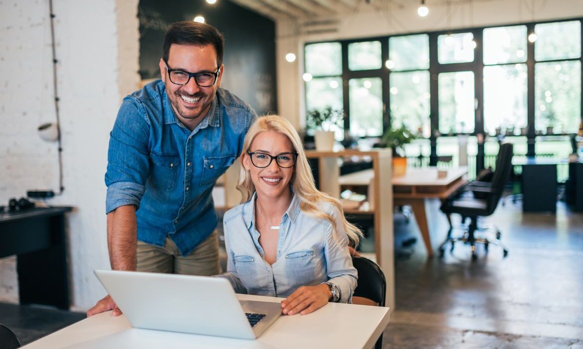 small business owners looking at laptop